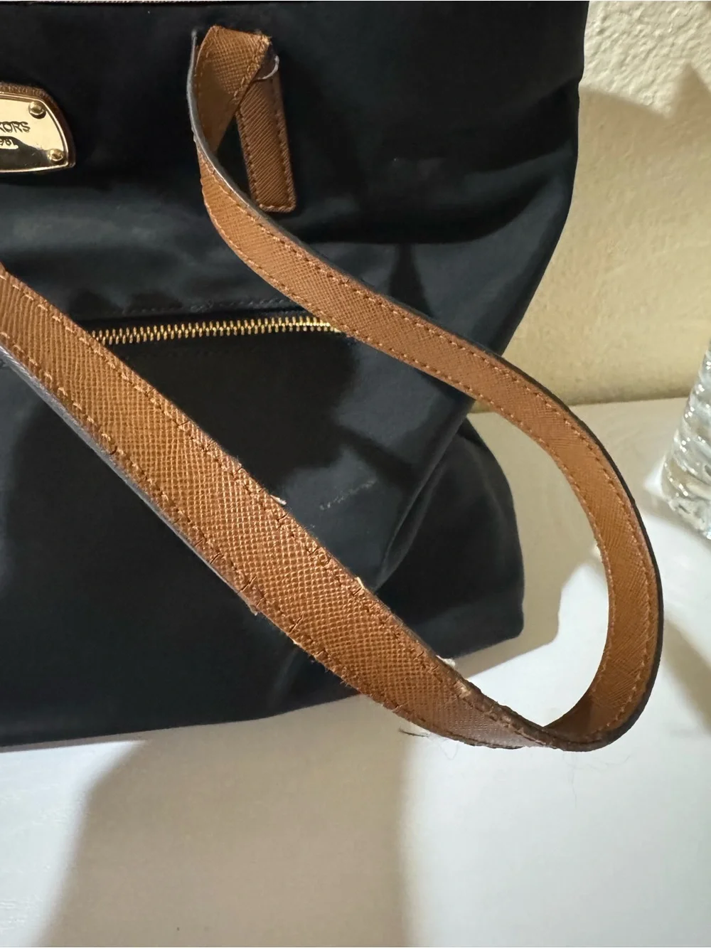 Michael Kors Black Tote with Brown Trim and Gold Plate